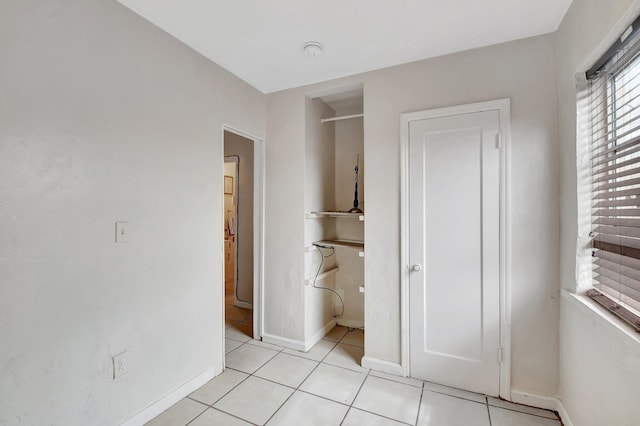 701 S J St, Lake Worth Beach, FL 33460 - unfurnished bedroom with light tile patterned floors and baseboards