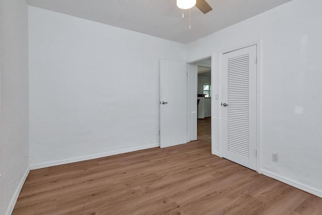 713 10th Ave N, Lake Worth Beach, FL 33460 - spare room with light wood-style flooring, ceiling fan, and baseboards