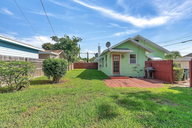 713 10th Ave N, Lake Worth Beach, FL 33460 - rear view of property featuring a wooden deck