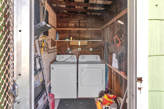 713 10th Ave N, Lake Worth Beach, FL 33460 - washroom with washer and dryer and wooden walls