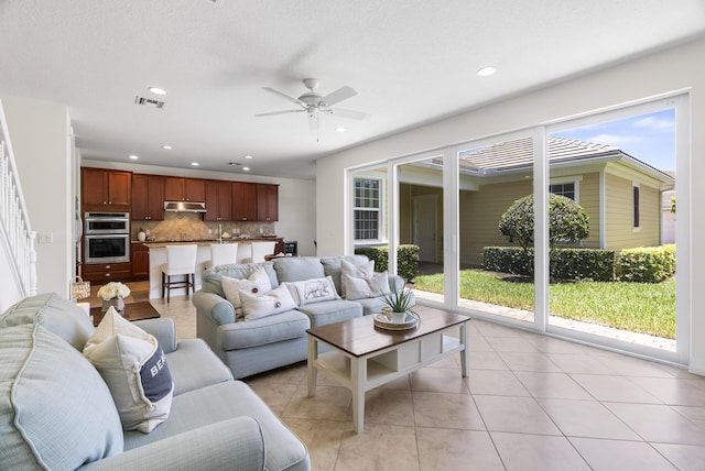 2757 Wymberly Dr, Jupiter, FL 33458 - living room with ceiling fan, recessed lighting, and light tile patterned flooring