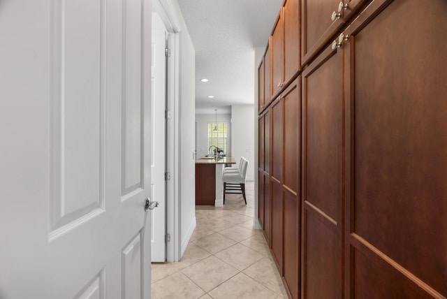 2757 Wymberly Dr, Jupiter, FL 33458 - hallway featuring light tile patterned floors, recessed lighting, and baseboards