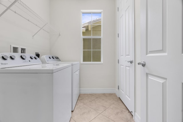 2757 Wymberly Dr, Jupiter, FL 33458 - laundry area featuring separate washer and dryer, baseboards, and light tile patterned floors