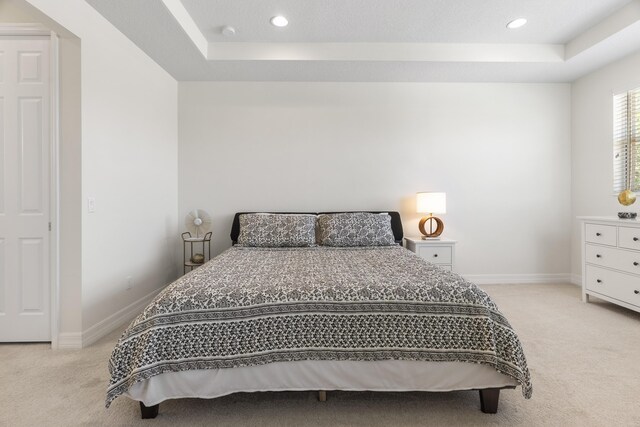 2757 Wymberly Dr, Jupiter, FL 33458 - bedroom with light carpet, a tray ceiling, baseboards, and recessed lighting