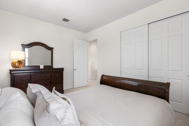 2757 Wymberly Dr, Jupiter, FL 33458 - bedroom featuring carpet floors, a closet, and baseboards