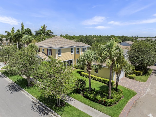 2757 Wymberly Dr, Jupiter, FL 33458 - view of front of house with driveway and a garage