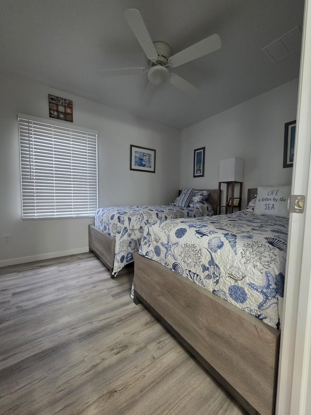 319 N J St, Lake Worth Beach, FL 33460 - bedroom featuring wood finished floors, ceiling fan, and baseboards