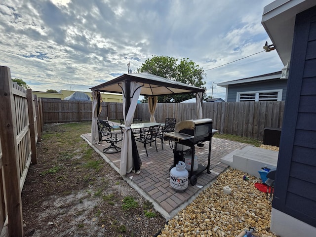 319 N J St, Lake Worth Beach, FL 33460 - fenced backyard featuring a gazebo, a patio, and outdoor dining area