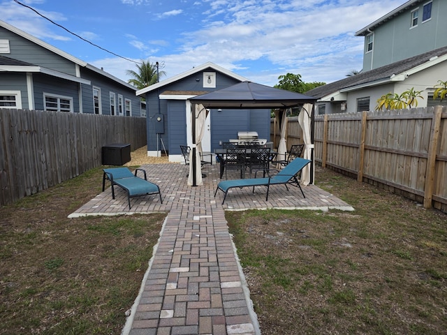319 N J St, Lake Worth Beach, FL 33460 - fenced backyard with a gazebo and a patio
