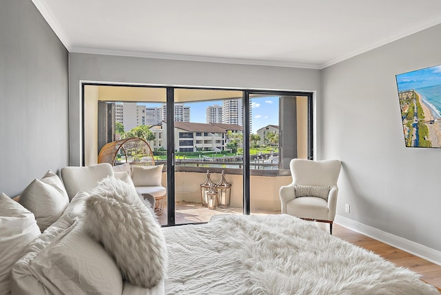 1124 Marine Way W D2R + Boat Slip 19, North Palm Beach, FL 33408 - bedroom featuring access to exterior, crown molding, wood finished floors, and baseboards