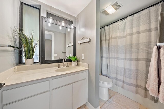 1124 Marine Way W D2R + Boat Slip 19, North Palm Beach, FL 33408 - bathroom featuring toilet, vanity, and tile patterned flooring