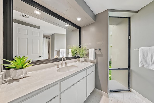 1124 Marine Way W D2R + Boat Slip 19, North Palm Beach, FL 33408 - full bath featuring baseboards, vanity, tile patterned flooring, recessed lighting, and curtained shower