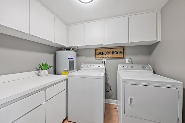 1124 Marine Way W D2R + Boat Slip 19, North Palm Beach, FL 33408 - laundry room with electric water heater, washer and clothes dryer, cabinet space, and light wood-style floors