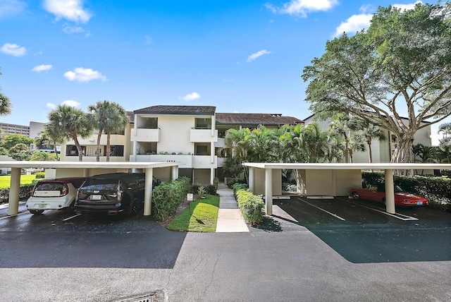 1124 Marine Way W D2R + Boat Slip 19, North Palm Beach, FL 33408 - view of building exterior with covered parking
