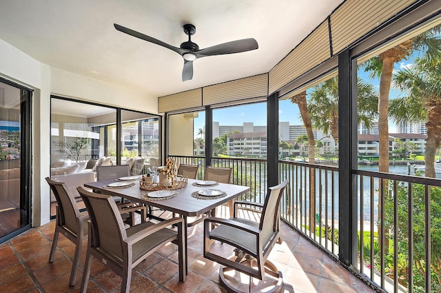 1124 Marine Way W D2R + Boat Slip 19, North Palm Beach, FL 33408 - sunroom featuring a ceiling fan, a water view, and outdoor dining area