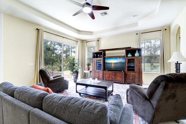 17560 72nd Rd N, The Acreage, FL 33470 - living room featuring a ceiling fan and a raised ceiling