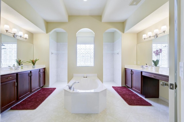 17560 72nd Rd N, The Acreage, FL 33470 - full bath featuring a garden tub, a walk in shower, two vanities, and tile patterned floors