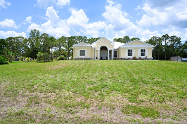17560 72nd Rd N, The Acreage, FL 33470 - ranch-style home with a front yard and stucco siding