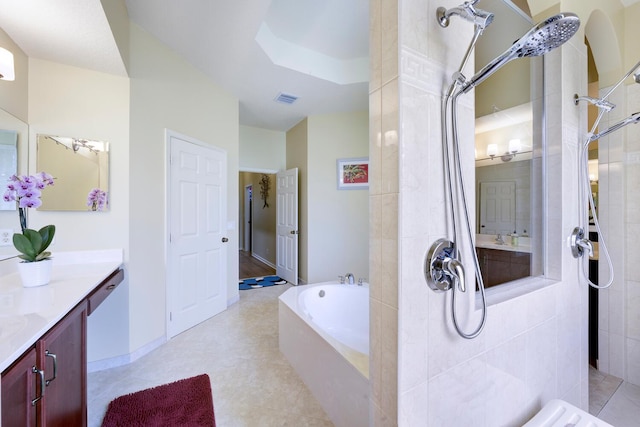 17560 72nd Rd N, The Acreage, FL 33470 - bathroom with vanity, a tile shower, and a garden tub