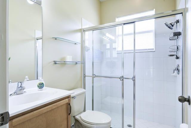 17560 72nd Rd N, The Acreage, FL 33470 - bathroom with toilet, vanity, and a shower stall