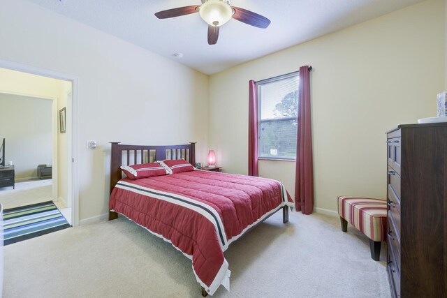 17560 72nd Rd N, The Acreage, FL 33470 - carpeted bedroom featuring baseboards and a ceiling fan