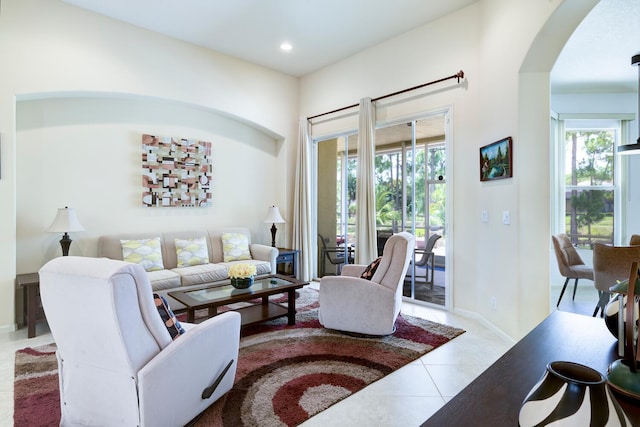 17560 72nd Rd N, The Acreage, FL 33470 - tiled living room featuring arched walkways, recessed lighting, and baseboards