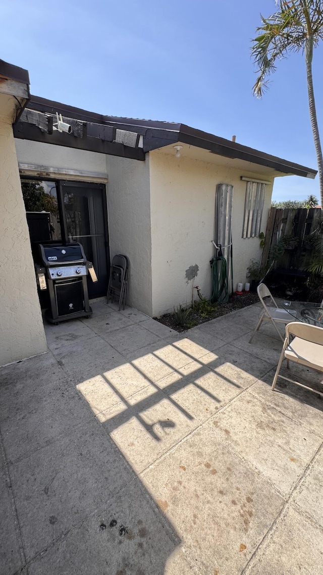 1301 Waterview Cir, Palm Springs, FL 33461 - back of house featuring stucco siding and a patio area