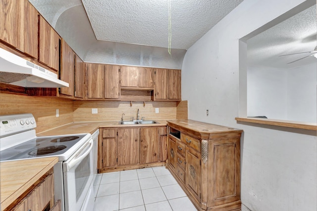 6160 SW 4th St, Margate, FL 33068 - kitchen with electric stove, a sink, a textured ceiling, under cabinet range hood, and light countertops