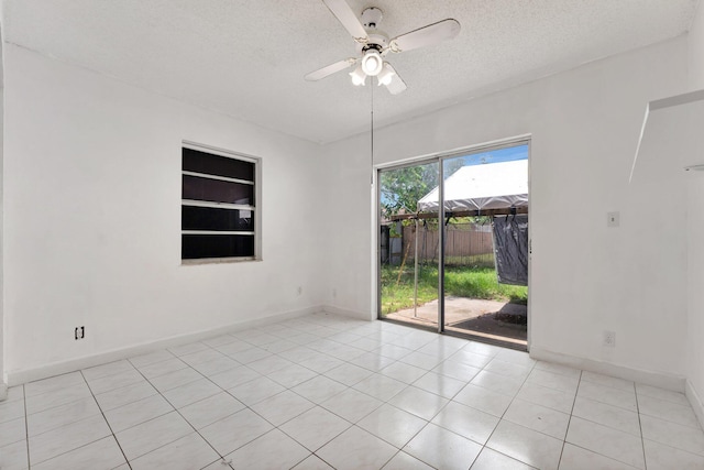 6160 SW 4th St, Margate, FL 33068 - empty room with a textured ceiling, ceiling fan, light tile patterned floors, and baseboards