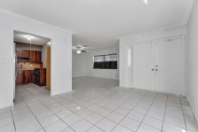 6160 SW 4th St, Margate, FL 33068 - unfurnished living room with light tile patterned floors, a ceiling fan, baseboards, and a sink