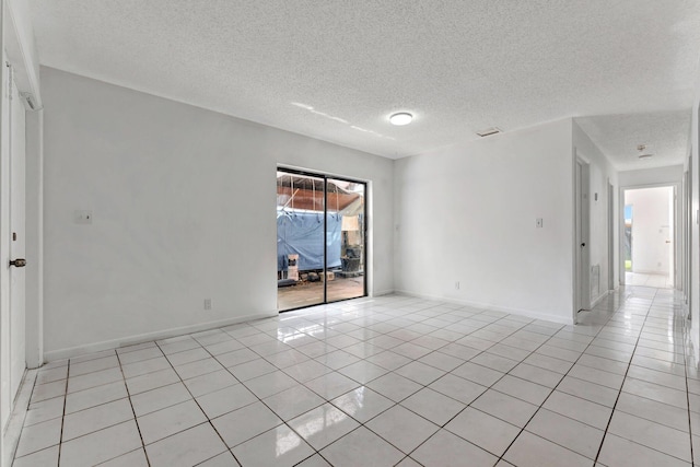 6160 SW 4th St, Margate, FL 33068 - spare room featuring light tile patterned floors, a textured ceiling, and baseboards