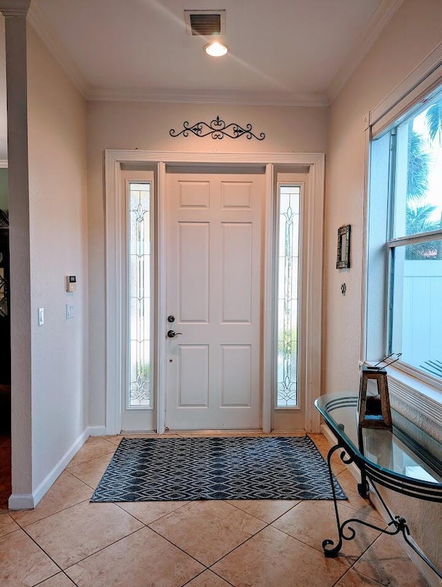 3104 SW Porpoise Cir, Stuart, FL 34997 - foyer entrance with light tile patterned flooring, ornamental molding, and baseboards