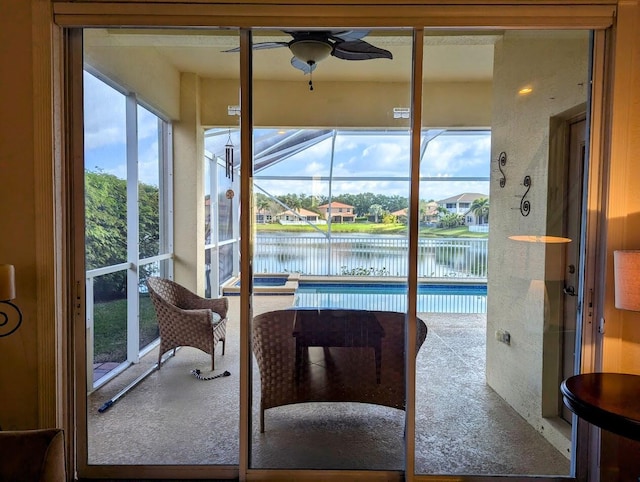 3104 SW Porpoise Cir, Stuart, FL 34997 - sunroom with a water view and a ceiling fan