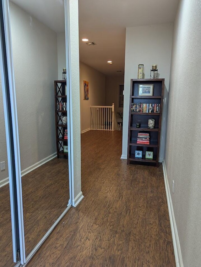 3104 SW Porpoise Cir, Stuart, FL 34997 - hallway featuring an upstairs landing, wood finished floors, a textured wall, baseboards, and recessed lighting