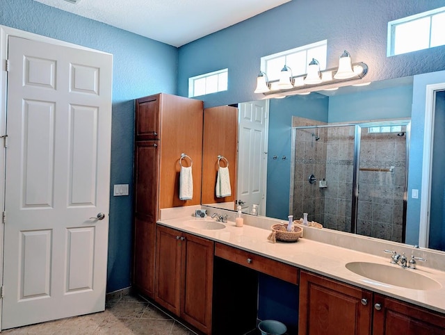 3104 SW Porpoise Cir, Stuart, FL 34997 - bathroom with a shower stall, double vanity, and a textured wall