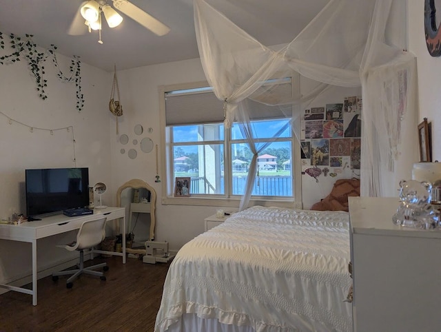 3104 SW Porpoise Cir, Stuart, FL 34997 - bedroom with dark wood-style floors and an office area