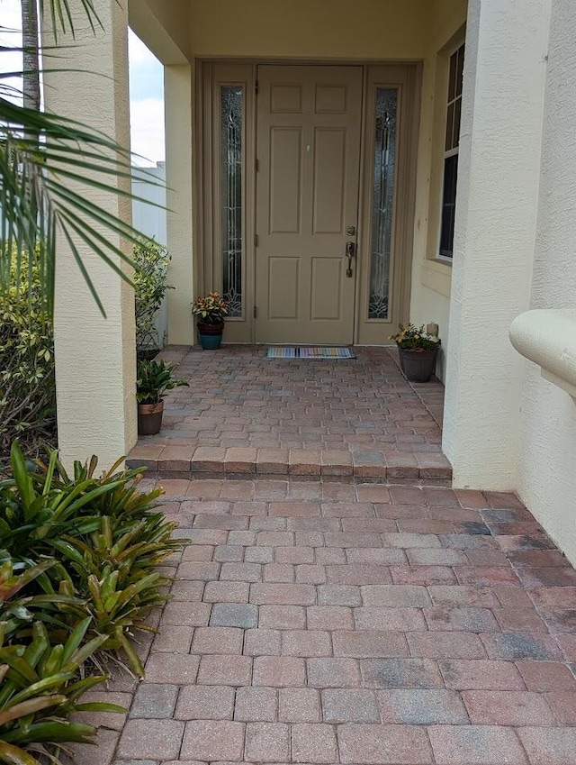 3104 SW Porpoise Cir, Stuart, FL 34997 - view of exterior entry featuring stucco siding