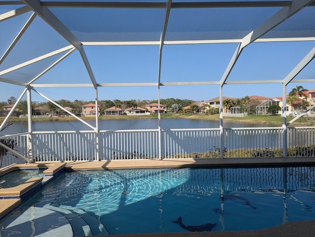 3104 SW Porpoise Cir, Stuart, FL 34997 - view of swimming pool with a water view, a residential view, a lanai, and a pool with connected hot tub