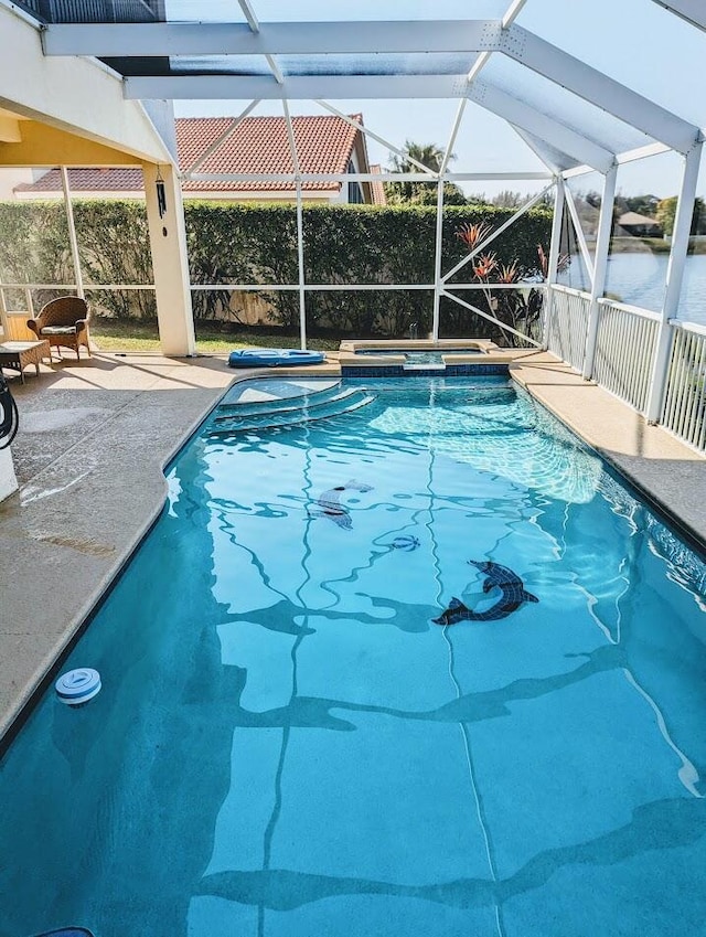 3104 SW Porpoise Cir, Stuart, FL 34997 - view of pool featuring a patio area, a lanai, and a pool with connected hot tub