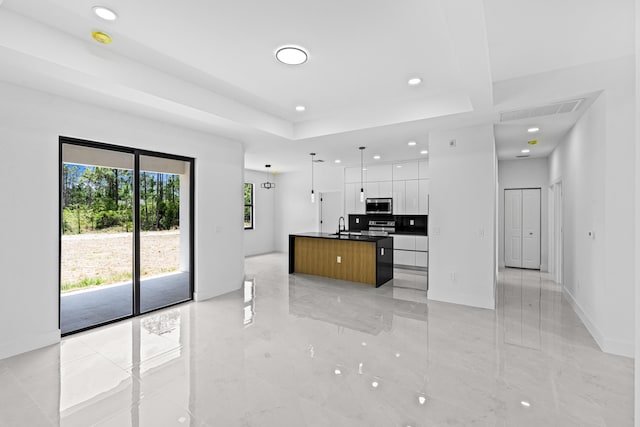 620 Raintree St E, Lehigh Acres, FL 33974 - kitchen featuring modern cabinets, stainless steel appliances, white cabinetry, a sink, and recessed lighting