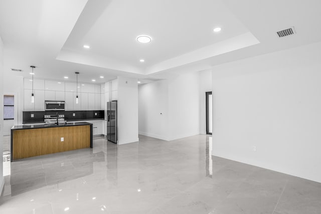 620 Raintree St E, Lehigh Acres, FL 33974 - kitchen with appliances with stainless steel finishes, open floor plan, modern cabinets, recessed lighting, and white cabinetry