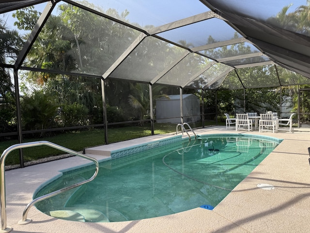 1810 Eucalyptus Ave, Fort Pierce, FL 34949 - outdoor pool featuring a patio area, glass enclosure, and a lawn