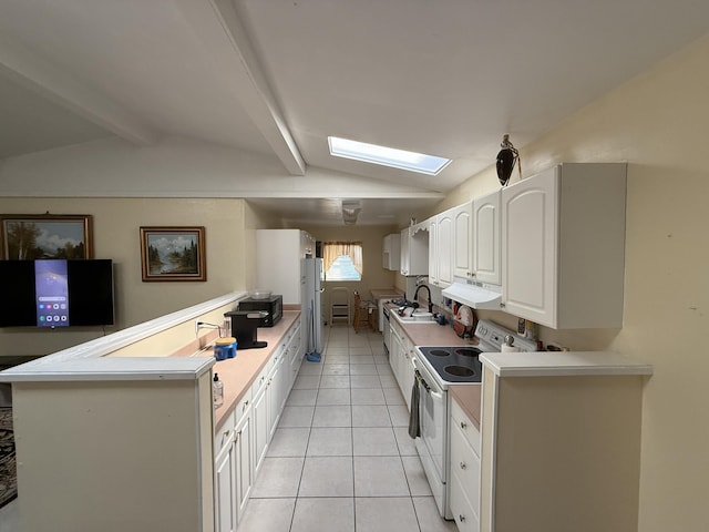 1810 Eucalyptus Ave, Fort Pierce, FL 34949 - kitchen with white appliances, light tile patterned flooring, a sink, under cabinet range hood, and white cabinetry