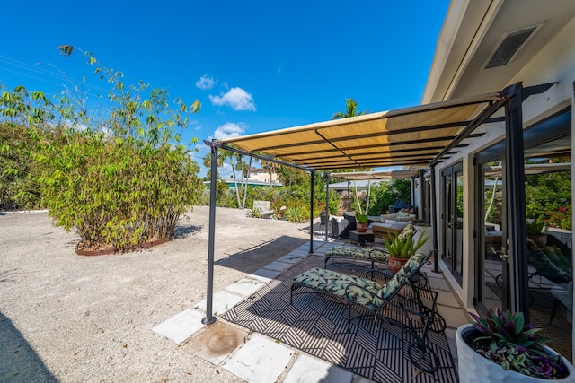 1501 S Palmway, Lake Worth, FL 33460 - view of patio featuring an outdoor living space