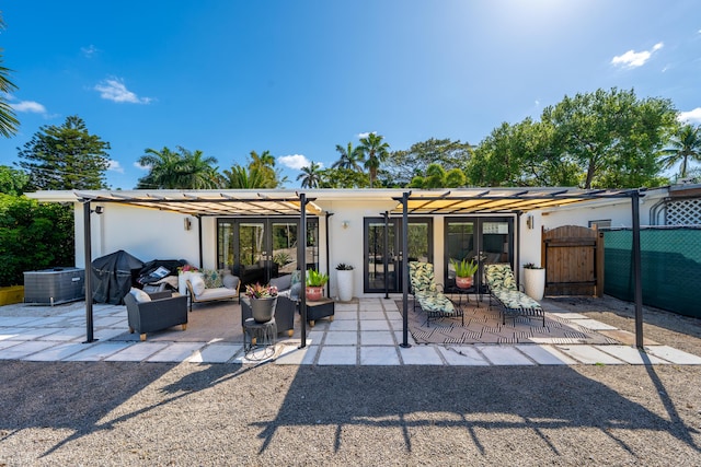1501 S Palmway, Lake Worth, FL 33460 - rear view of property with a gate, a patio, stucco siding, and an outdoor living space