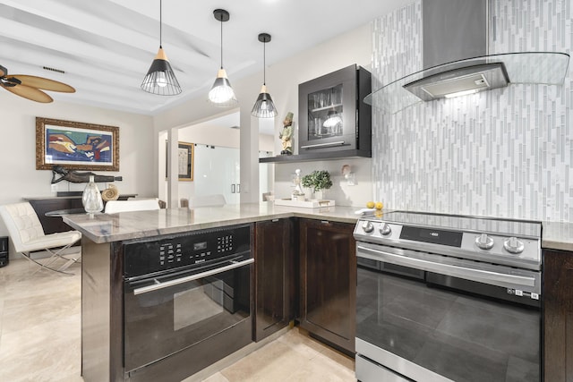 1501 S Palmway, Lake Worth, FL 33460 - kitchen featuring stainless steel electric range oven, oven, wall chimney exhaust hood, dark brown cabinetry, and light stone counters