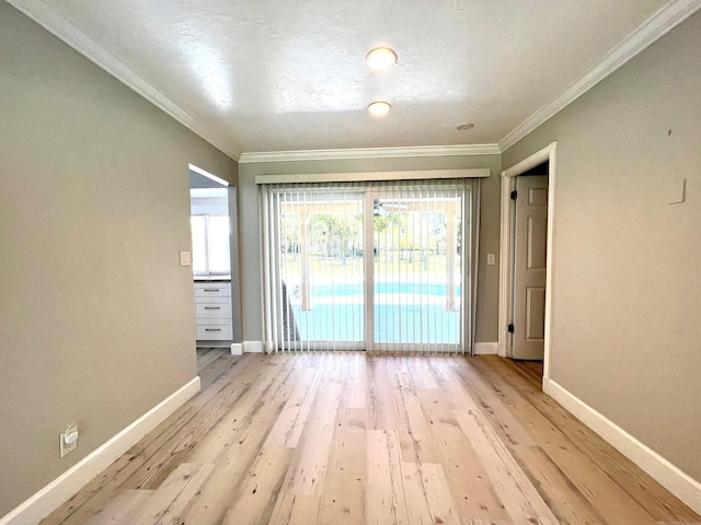 115 Sandpiper Ave, Royal Palm Beach, FL 33411 - empty room featuring baseboards, ornamental molding, and light wood-style flooring