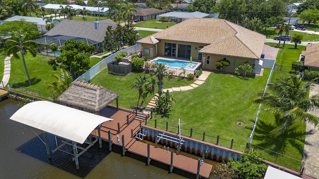 401 SE Verada Ave, Port Saint Lucie, FL 34983 - view from above of property with a nearby body of water and a pool area