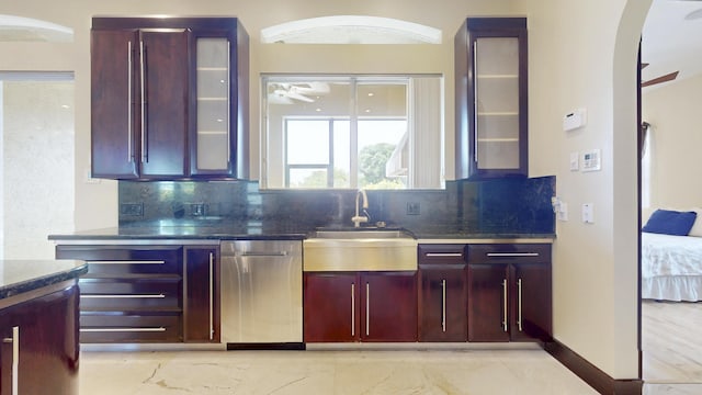 401 SE Verada Ave, Port Saint Lucie, FL 34983 - kitchen with a sink, ceiling fan, stainless steel dishwasher, and decorative backsplash