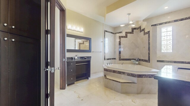 401 SE Verada Ave, Port Saint Lucie, FL 34983 - bathroom with vanity, a bath, ceiling fan, and marble finish flooring
